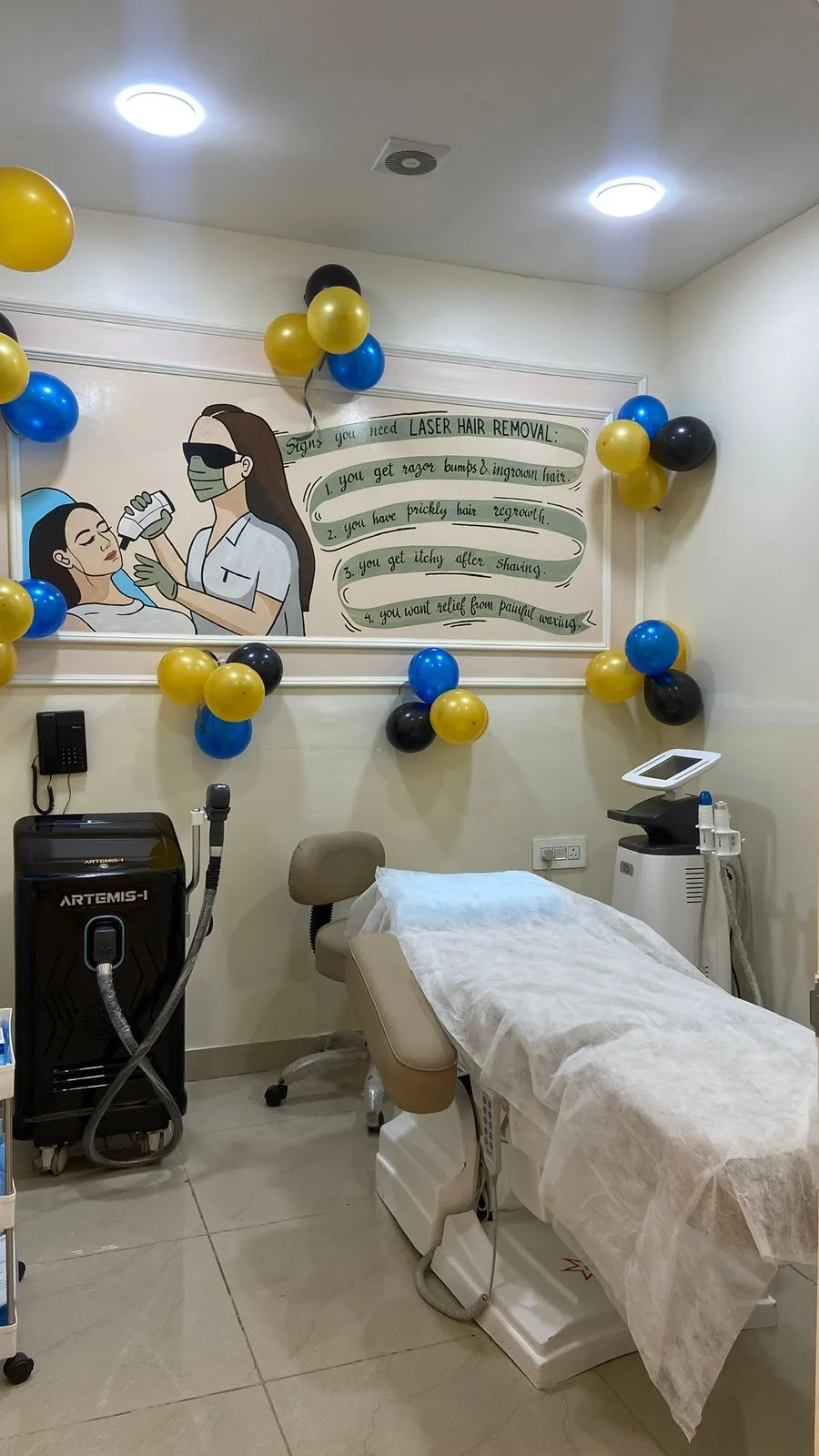 Laser hair removal room with ARTEMIS-I diode laser and treatment bed